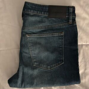 One pair of blue denim jeans.